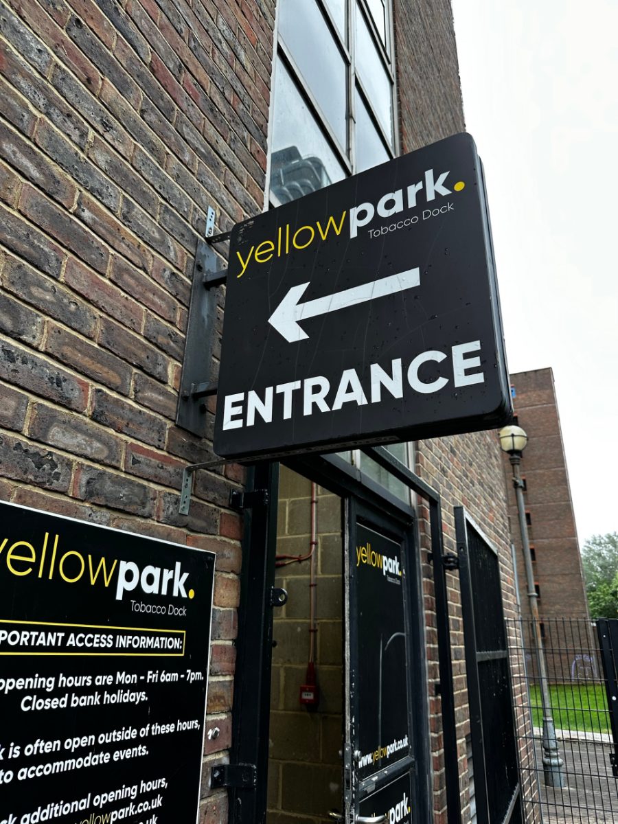 The Yellow Park entrance sign at Tobacco Dock